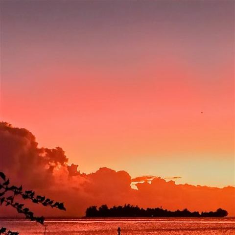 Fiery sky at sunset over the Bora Bora lagoon